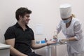 Doctor takes a blood test from the patient