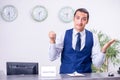 Young man receptionist at the hotel counter Royalty Free Stock Photo