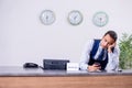 Young man receptionist at the hotel counter Royalty Free Stock Photo