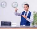 Young man receptionist at the hotel counter Royalty Free Stock Photo