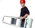 Young man in red hard hat holding stepladder