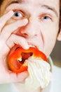 Young man with red pepper. humor Royalty Free Stock Photo