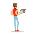 Young man in a red sleeveless vest standing and using laptop, back view. Colorful character vector Illustration