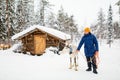 Young man and reindeer in Lapland Royalty Free Stock Photo