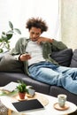 Young man relaxes on a cozy Royalty Free Stock Photo