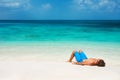 Young man relaxing on the beach