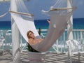 Young man relaxing in Caribbean hammock Royalty Free Stock Photo