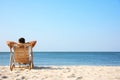 Young man relaxing in deck chair Royalty Free Stock Photo