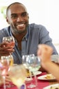 Young Man Relaxing At Dinner Party Royalty Free Stock Photo