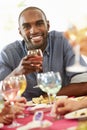 Young Man Relaxing At Dinner Party Royalty Free Stock Photo