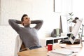 Young man relaxing in office during break Royalty Free Stock Photo