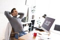 Young man relaxing in office during break Royalty Free Stock Photo