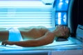 Young man relaxing during solarium treatment Royalty Free Stock Photo