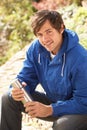 Young Man Relaxing With Thermos Flask In Autumn La