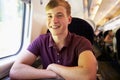 Young Man Relaxing On Train Journey Royalty Free Stock Photo