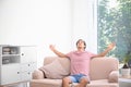Young man relaxing under air conditione Royalty Free Stock Photo
