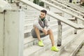 Young man relaxing in between workouts Royalty Free Stock Photo