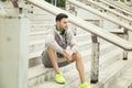 Young man relaxing in between workouts Royalty Free Stock Photo