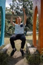 Young Man Reliving His Childhood Plying In A Children`s Playground