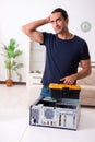 Young man repairing computer at home Royalty Free Stock Photo