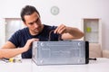 Young man repairing computer at home Royalty Free Stock Photo