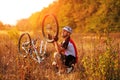 Young man repairing mountain bike in the forest Royalty Free Stock Photo