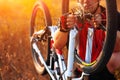 Young man repairing mountain bike in the forest Royalty Free Stock Photo