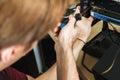 Young man repairs a computer system unit, changes parts, video card and hard drive, sets new components. Computer Repair Royalty Free Stock Photo