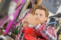 Young man reparing bike with tools