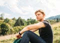 Young man rest on the green meadow Royalty Free Stock Photo