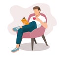 Young man resting in armchair with book and cup of coffee Royalty Free Stock Photo