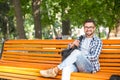 Young man resting on the bench outdoors Royalty Free Stock Photo