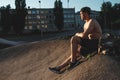 Young man resting after training, sportsman, outdoor training in the city copy space