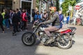 Young man on retro motorbike circulating in Amsterdam, Netherlands
