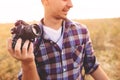 Young Man with retro photo camera outdoor hipster Lifestyle Royalty Free Stock Photo