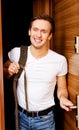 Young man returning home from work or trip Royalty Free Stock Photo