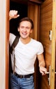 Young man returning home from work or trip Royalty Free Stock Photo