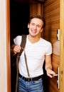 Young man returning home from work or trip Royalty Free Stock Photo