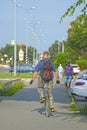 A young man rides around the city on a monocycle. Russia. Abakan