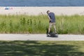 The young man rides on Onewheel