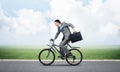 Young man riding bicycle on highway