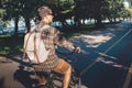 Young Man Riding On Bicycle In Summer Park, Cyclist In motion, Rear View. Lifestyle Urban Resting Concept