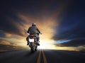 Young man riding big bike motocycle on asphalt high way against