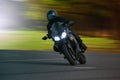 Young man riding big bike motorcycle on asphalt high way against Royalty Free Stock Photo