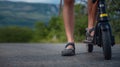 Young man riding an electric scooter on mountain range. Ecological transportation concept Royalty Free Stock Photo