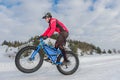 Fat bike. Fat tire bike. A young man riding fat bicycle in the winter