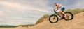 Man riding a fat bike through the beach dunes Royalty Free Stock Photo