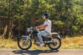 Young man riding his motorbike on open road Royalty Free Stock Photo