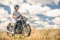 Young man riding his motorbike on open road Royalty Free Stock Photo