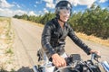 Young man riding his motorbike on open road Royalty Free Stock Photo